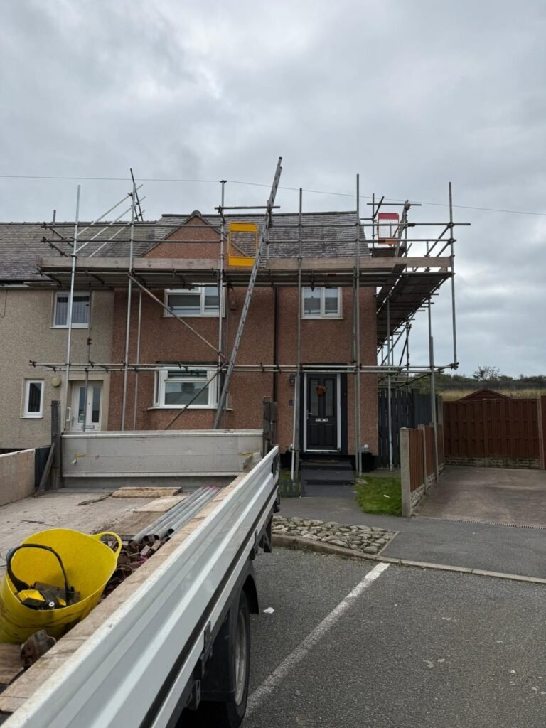 Working on house with scaffolding